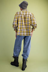 Yellow plaid ruffle down top