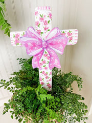 Pink roses on cross with bow