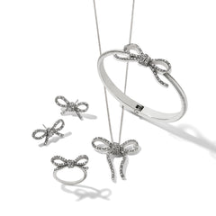 Illumina bow hinged bangle